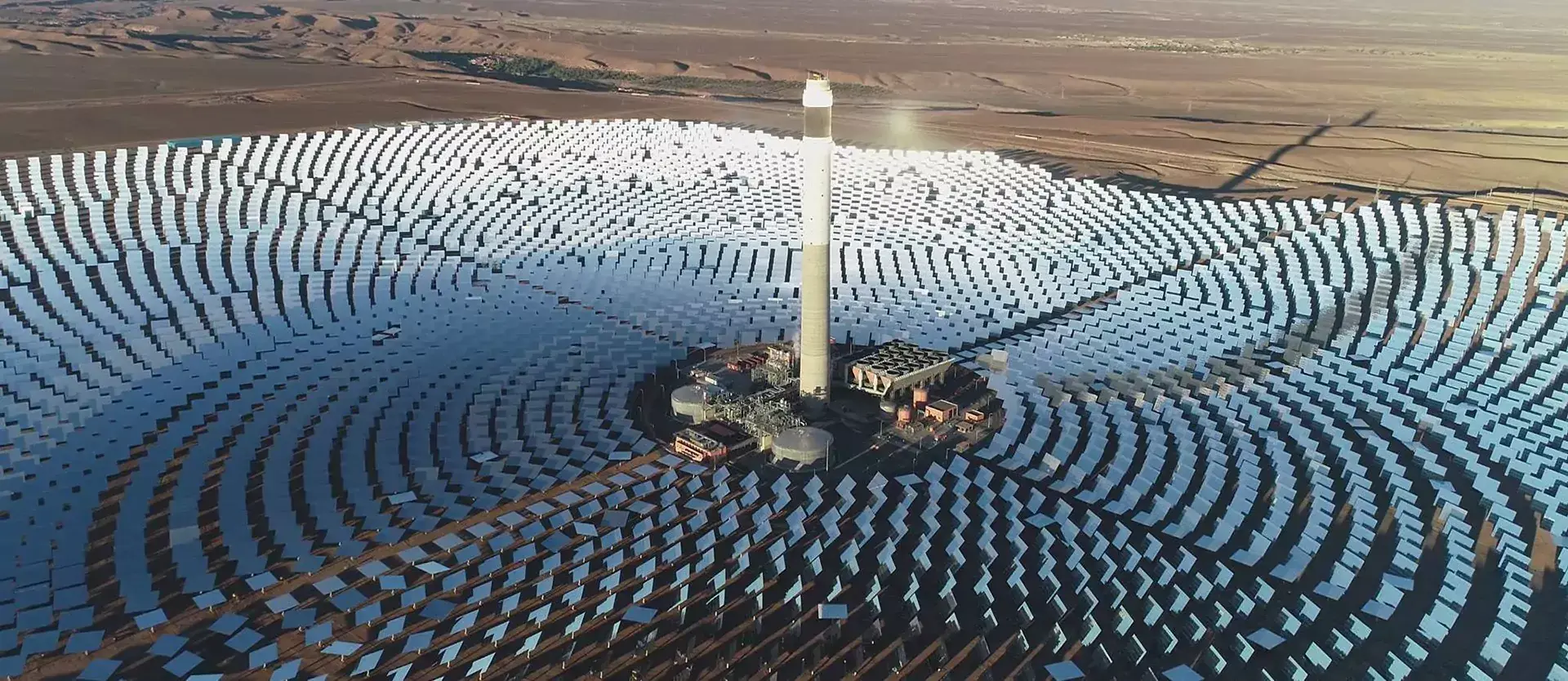 Drone view of Morocco's Noor Ouarzazate Concentrated Solar Power Plant. It is the world's largest CSP facility, spanning an area the size of the Moroccan capital city.