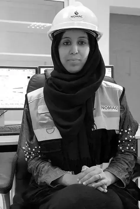 Zineb Aghzou, a female engineer, sitting in her office at Morocco's Noor Ouarzazate Concentrated Solar Power Plant